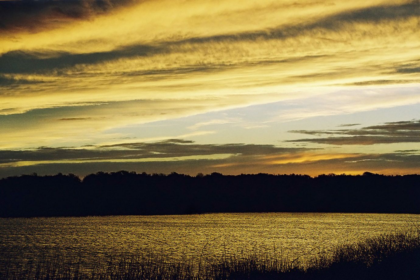 Sunset at the lake at a November day. Sunset at the lake at a November day.